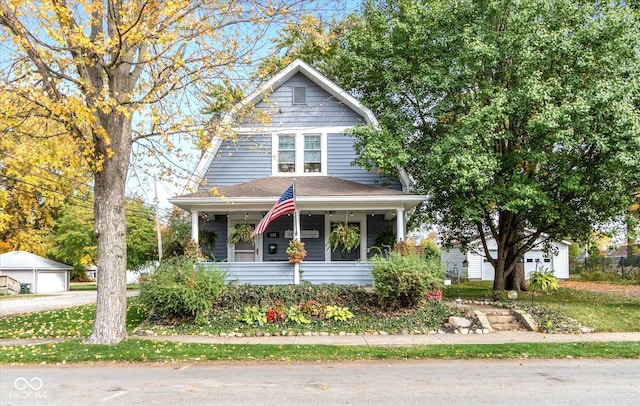 view of front of house with an outdoor structure and covered porch