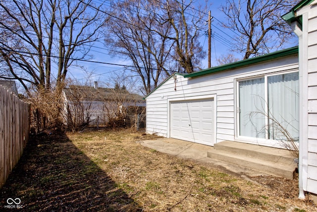 garage with fence