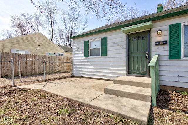 property entrance featuring fence