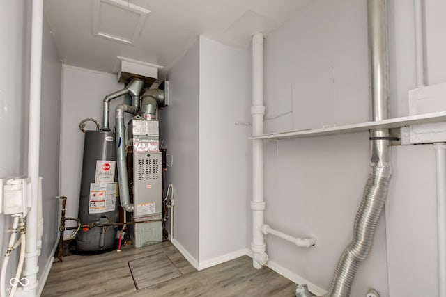 utility room featuring gas water heater