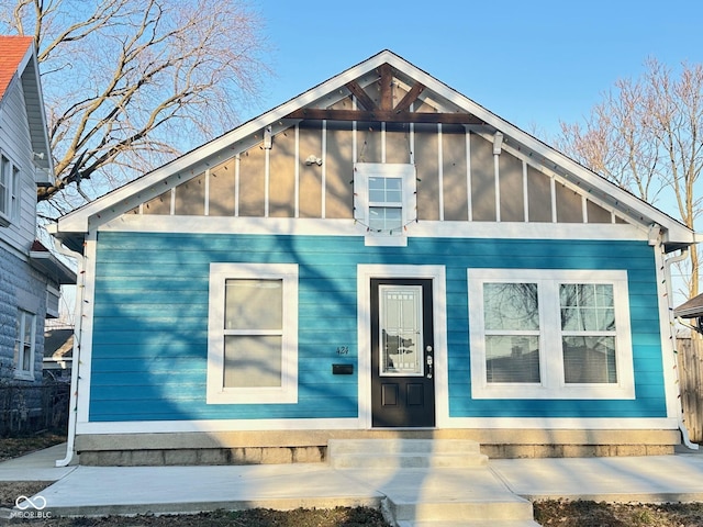 view of front of property featuring board and batten siding and a sunroom