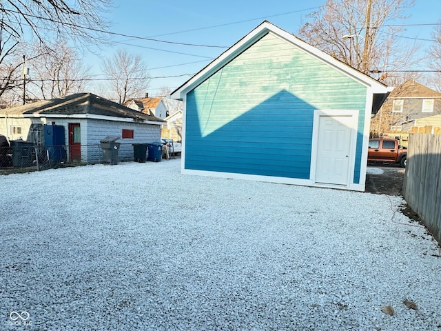 garage with fence