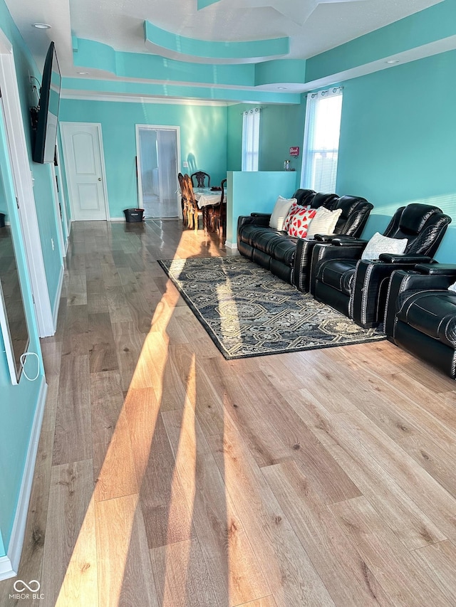 living room featuring baseboards and wood finished floors