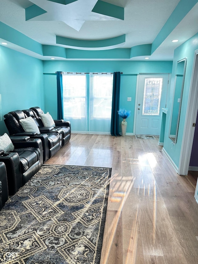 living room with baseboards and wood finished floors