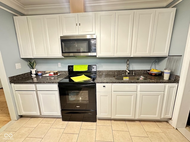 kitchen featuring a sink, stainless steel microwave, black range with electric stovetop, and white cabinetry