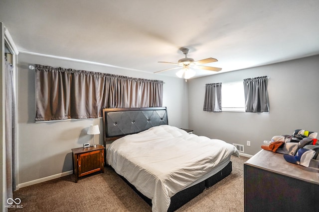 bedroom featuring visible vents, baseboards, a ceiling fan, and carpet flooring