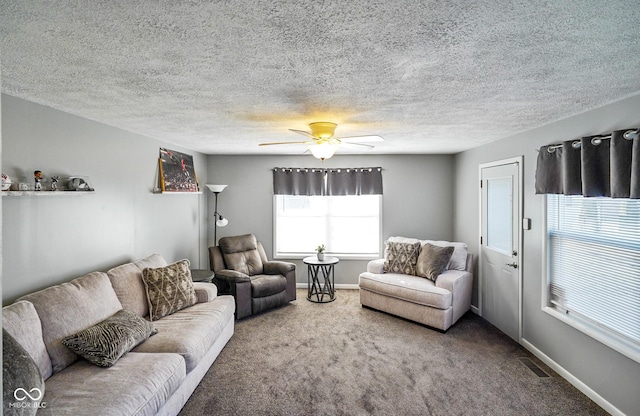 living room featuring baseboards, visible vents, and carpet floors