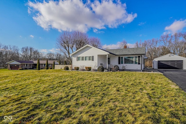 ranch-style home with an outdoor structure, a garage, a front lawn, and a chimney