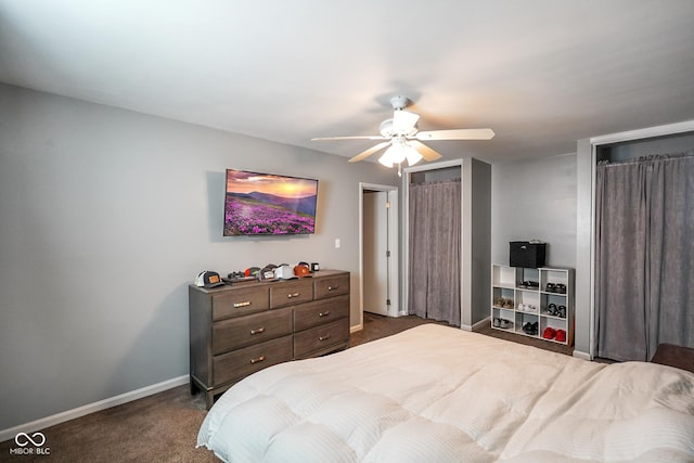 bedroom with a ceiling fan, baseboards, and dark carpet