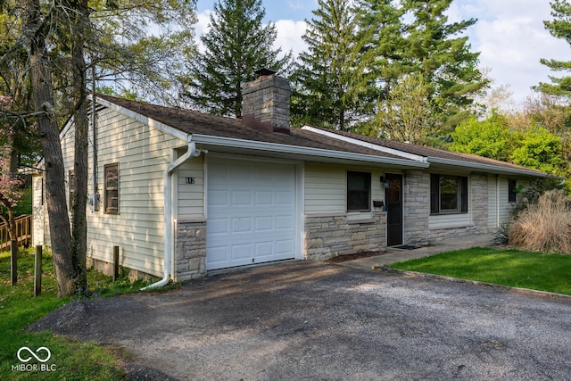 ranch-style house with a garage, driveway, and a chimney