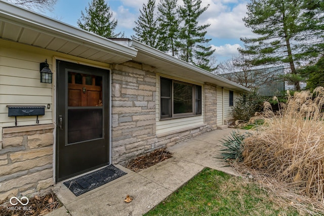 entrance to property with stone siding