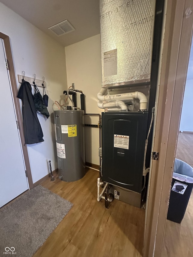 8 Gladiator Dr, Waynetown, IN 47990 - utilities with visible vents and electric water heater