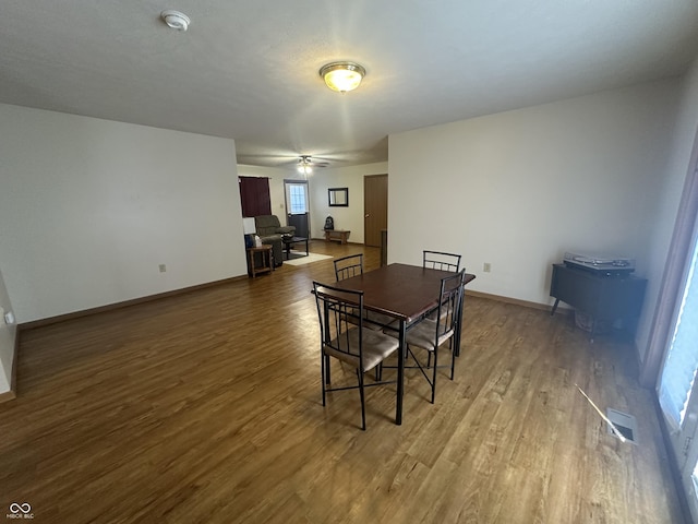 8 Gladiator Dr, Waynetown, IN 47990 - dining room featuring baseboards, visible vents, wood finished floors, and a ceiling fan