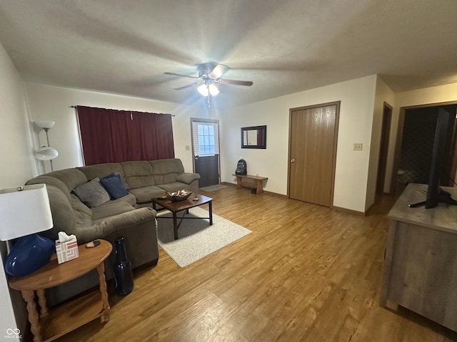8 Gladiator Dr, Waynetown, IN 47990 - living area with ceiling fan, light wood-type flooring, and baseboards