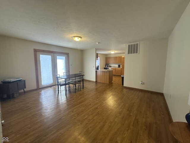 8 Gladiator Dr, Waynetown, IN 47990 - dining space featuring visible vents, baseboards, french doors, and dark wood finished floors