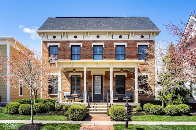 13018 Deerstyne Green St, Carmel, IN 46032 - italianate-style house with brick siding, a porch, and roof with shingles