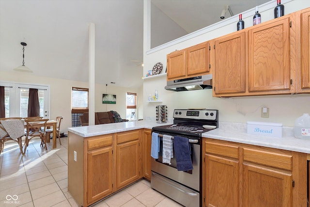 kitchen with under cabinet range hood, light countertops, light tile patterned floors, stainless steel electric range, and a peninsula