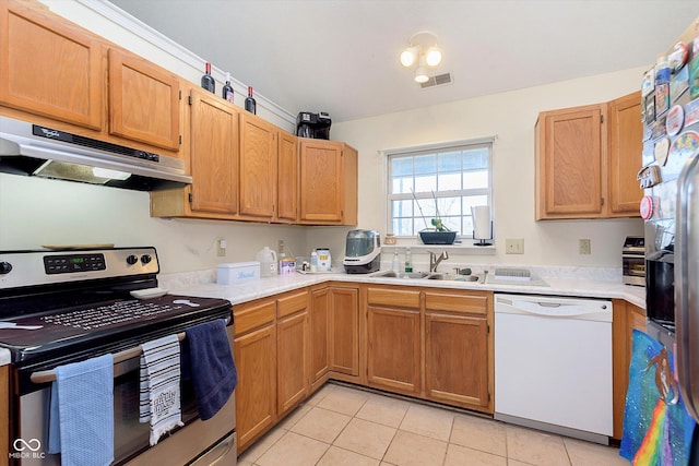 kitchen featuring visible vents, a sink, light countertops, under cabinet range hood, and appliances with stainless steel finishes