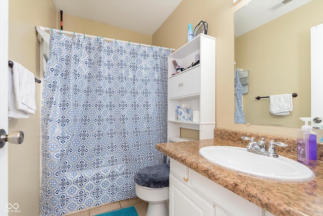 full bathroom featuring vanity, a shower with shower curtain, visible vents, tile patterned flooring, and toilet