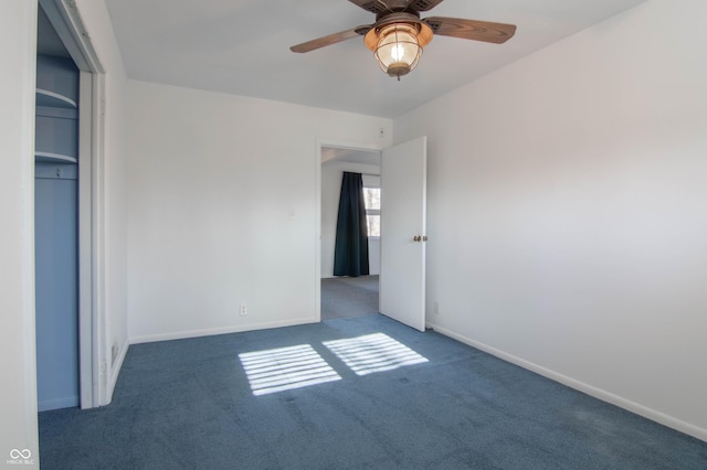 unfurnished bedroom with baseboards, carpet, and a ceiling fan