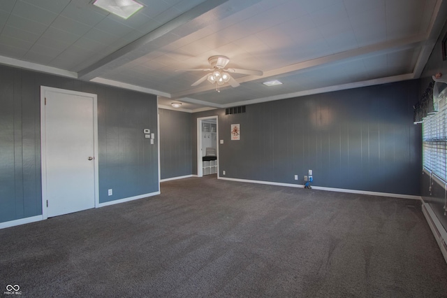 carpeted empty room featuring beamed ceiling, baseboard heating, baseboards, and a ceiling fan