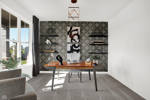 office area featuring an accent wall, carpet, baseboards, and wallpapered walls