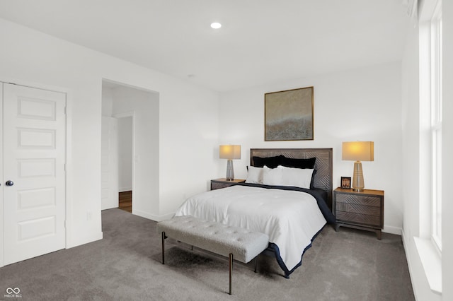 carpeted bedroom featuring recessed lighting and baseboards