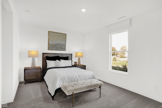 carpeted bedroom featuring recessed lighting, visible vents, and baseboards