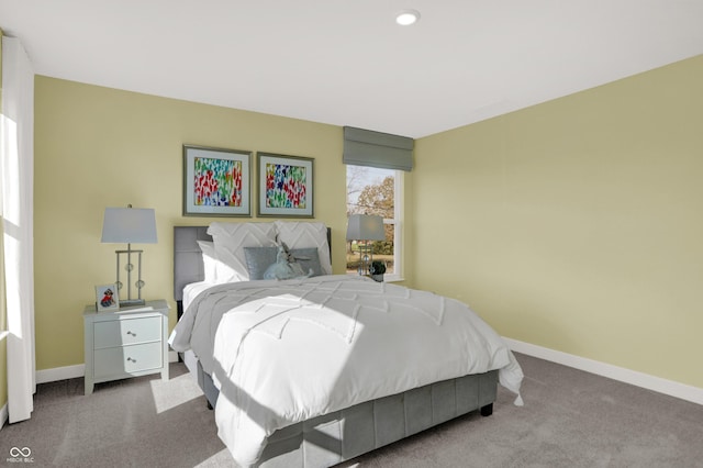 bedroom featuring baseboards and carpet floors