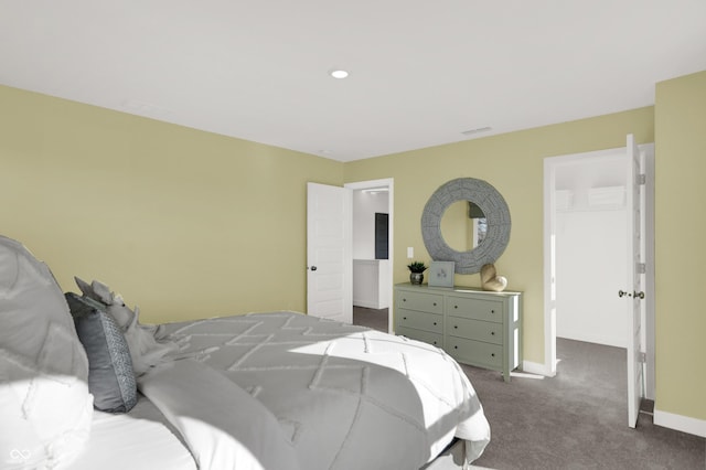 carpeted bedroom featuring visible vents and baseboards