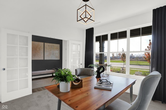 dining room featuring visible vents