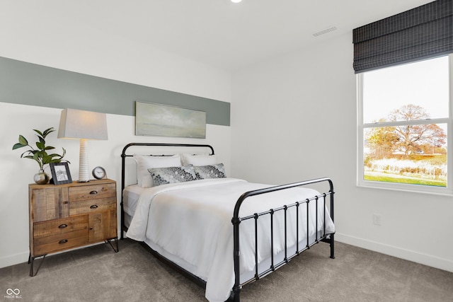 bedroom featuring carpet flooring, visible vents, and baseboards