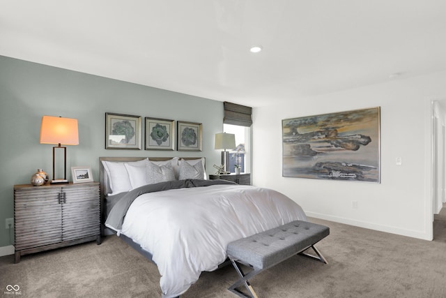 carpeted bedroom featuring baseboards