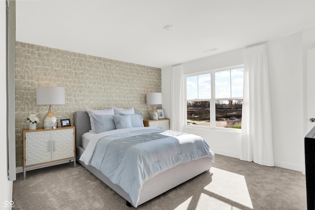 bedroom featuring baseboards and carpet floors