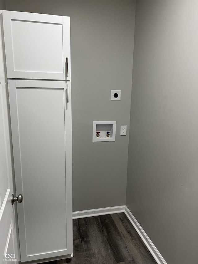 clothes washing area featuring baseboards, dark wood finished floors, washer hookup, cabinet space, and hookup for an electric dryer