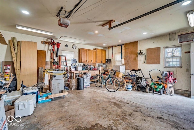 garage featuring recessed lighting and a garage door opener