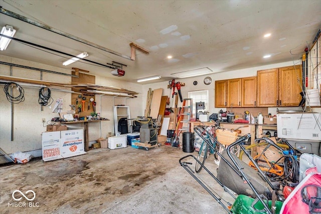 garage featuring a workshop area and a garage door opener