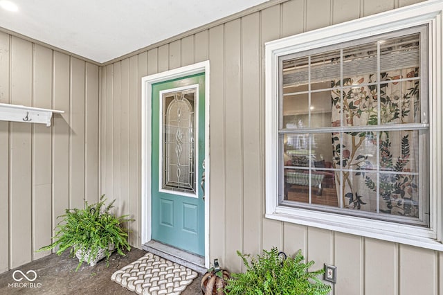 doorway to property with board and batten siding