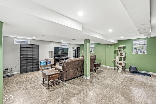 living area with recessed lighting and baseboards