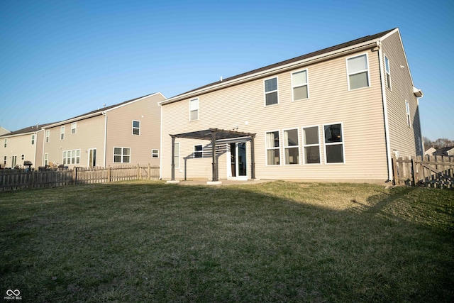 back of property featuring a lawn, a fenced backyard, and a pergola