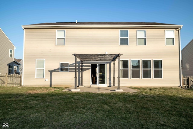 rear view of house featuring fence, a lawn, a patio, and a pergola