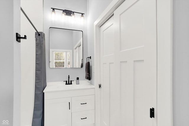 bathroom with vanity and a shower with shower curtain