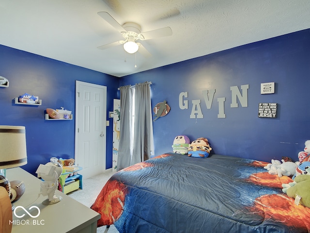 carpeted bedroom featuring a ceiling fan