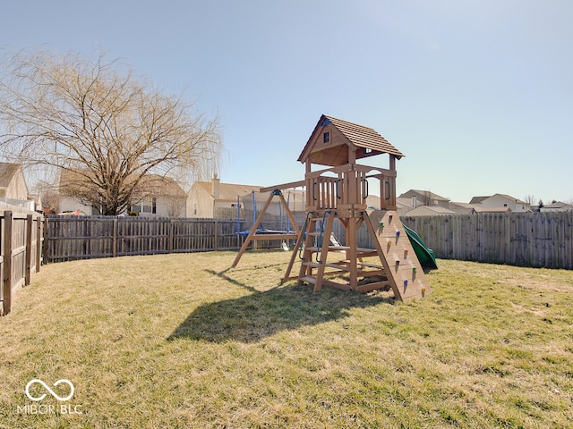 view of play area featuring a yard and a fenced backyard