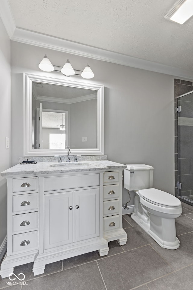 full bathroom featuring a shower stall, ornamental molding, toilet, and a textured ceiling