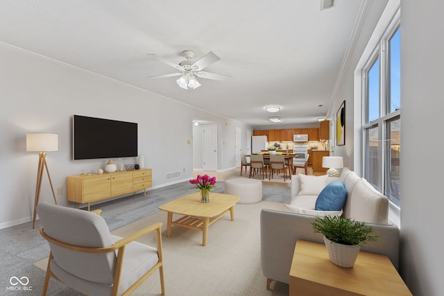 living room featuring visible vents, baseboards, and ceiling fan