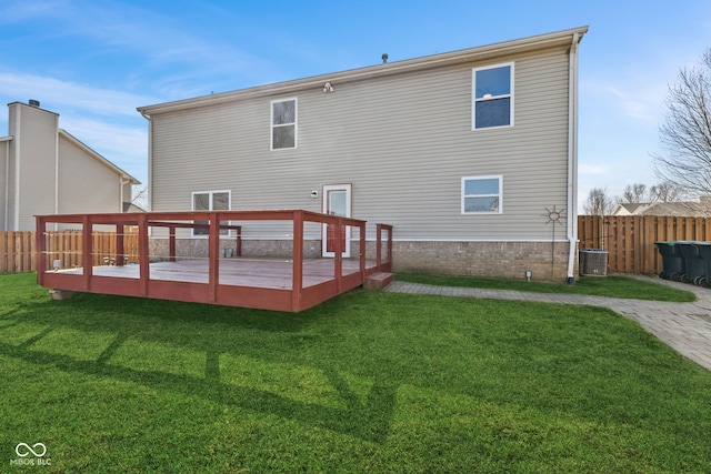 back of house featuring a deck, a yard, a fenced backyard, and cooling unit