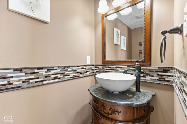 bathroom with backsplash and vanity