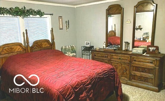 bedroom with ornamental molding