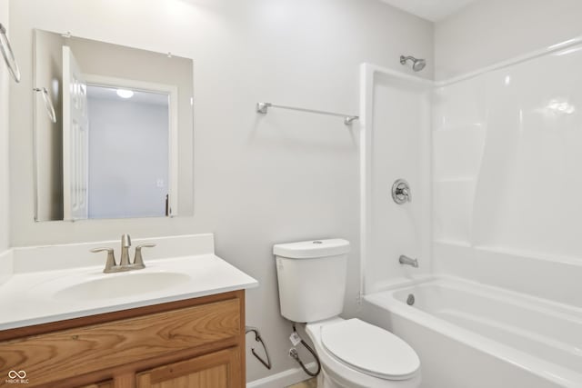 bathroom with bathing tub / shower combination, toilet, and vanity